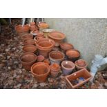 A large quantity of terracotta plant pots.