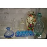 A pale green cut glass decanter and stopper and other glassware.