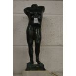 After the antique, a bronze male torso on a marble base.