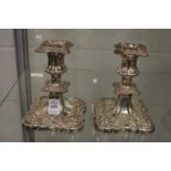 A pair of plated candlesticks.