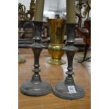 A pair of pewter candlesticks.