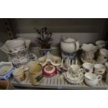 A shelf of decorative china.