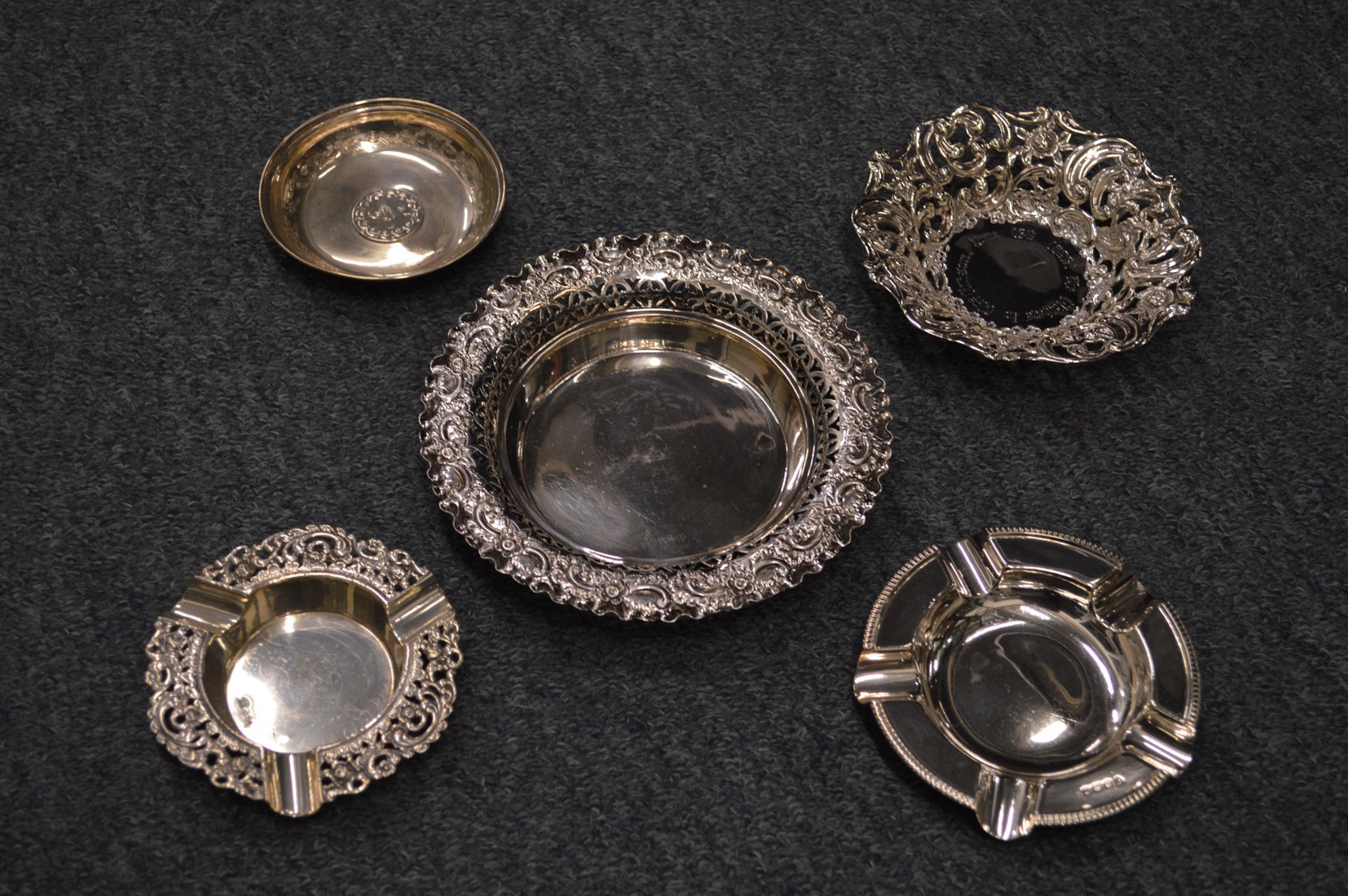 Various silver ashtrays and dishes.