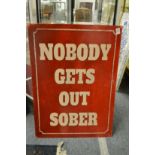 A novelty printed metal sign.