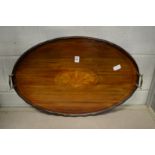 An Edwardian inlaid mahogany oval twin handled tray.