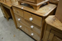 A small Victorian pine chest of drawers.