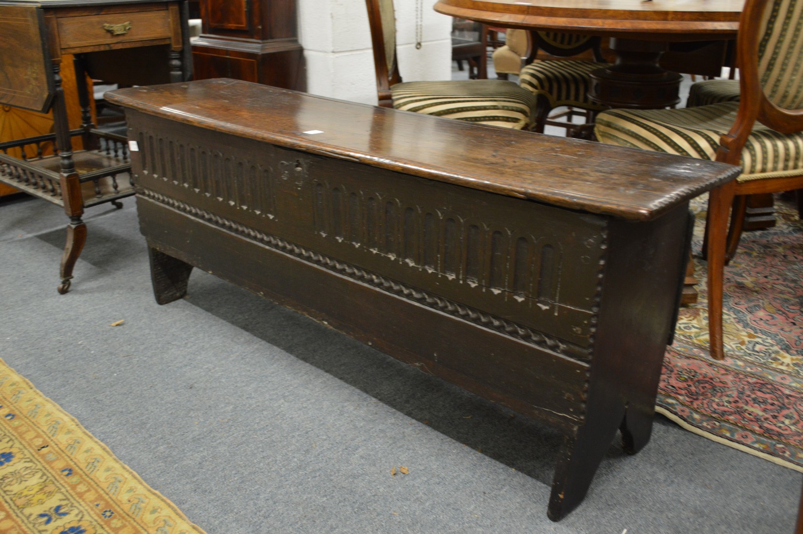 An 18th century oak six plank sword chest or coffer (one leg af).