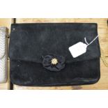 A ladies black velvet evening bag.