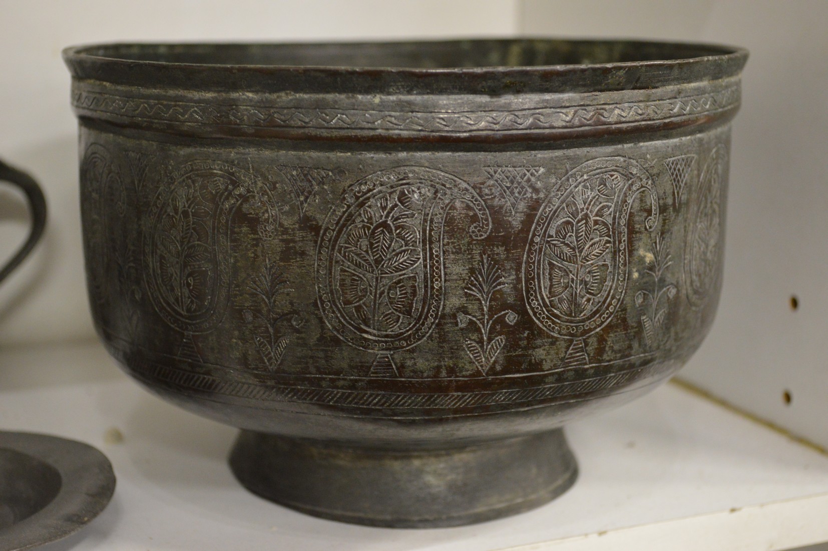 An Islamic tinned copper bowl, items of pewter and a bronze bell. - Image 2 of 2