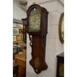 A Continental oak wall clock with painted arched dial.