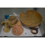 An early terracotta bowl and other similar items in excavated condition.