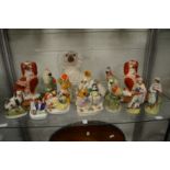 A good collection of Staffordshire figures to include dogs, birds, spill vases etc.