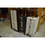 Three metal multi-drawer filing cabinets.