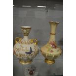 A Royal Worcester blush ivory twin handled bulbous vase painted with butterflies together with
