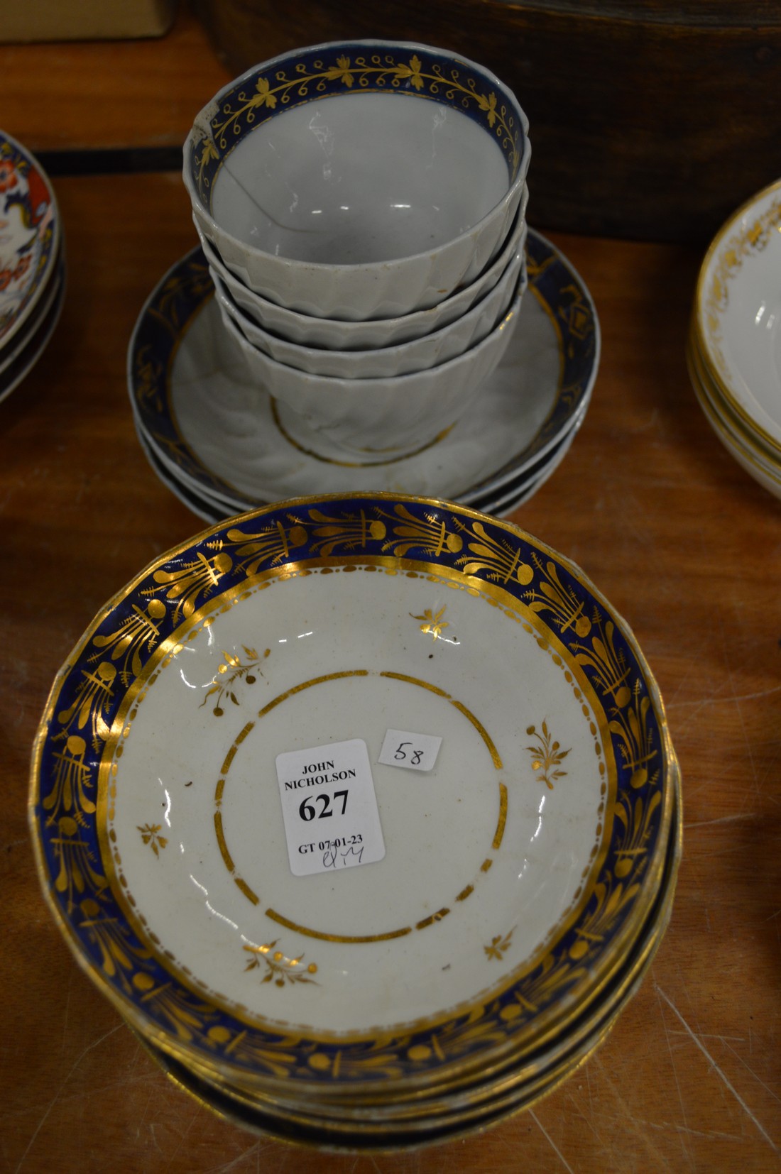 Six Worcester gilt decorated saucers and similar tea bowls and saucers.