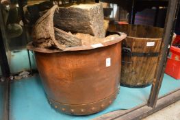 A copper log box and wooden jardiniere.