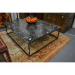 A good large fossilised marble top coffee table with wrought iron base.