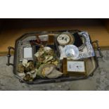 A plated twin handled tray containing miscellaneous collectables.