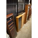 Four various wall hanging display cabinets.