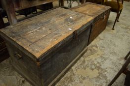 Two large wooden trunks containing numerous tools.