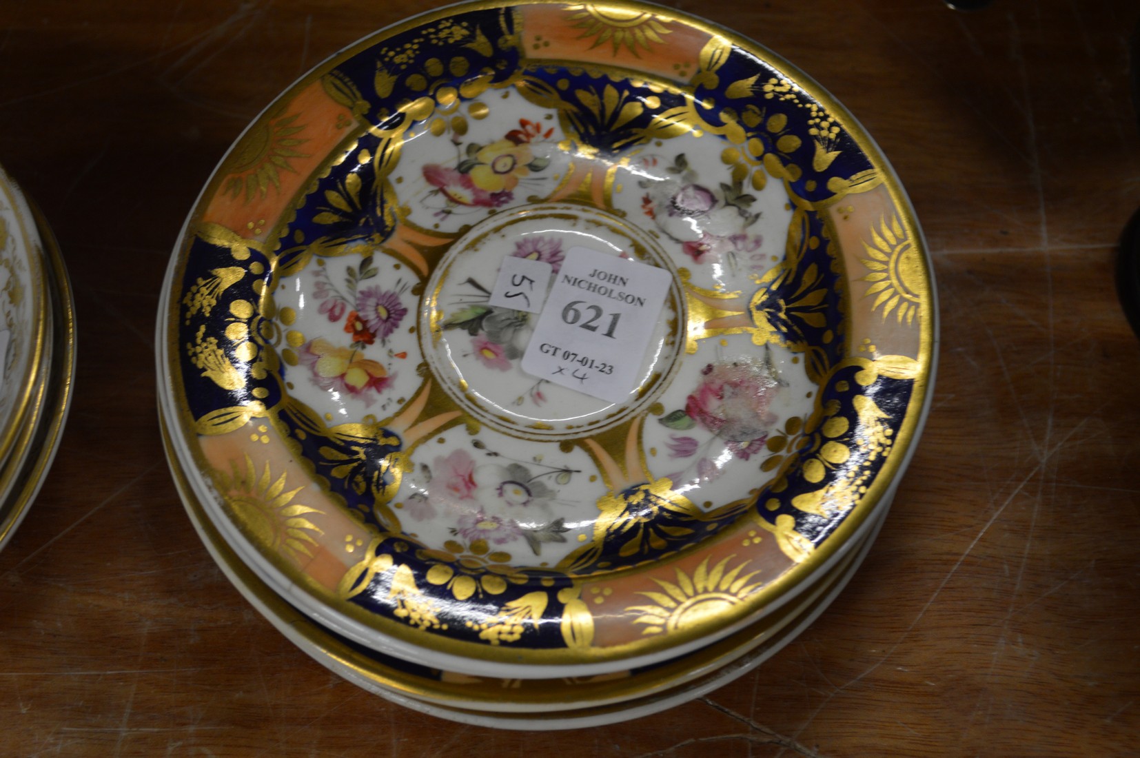 Four Coalport saucers.