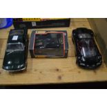 Three large model cars, one boxed.