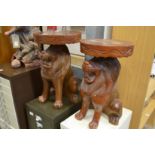 Two carved wood plant stands modelled as seated lions.