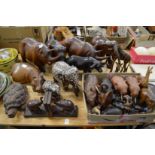 A large collection of carved hardwood animals to include elephants, hippos etc.
