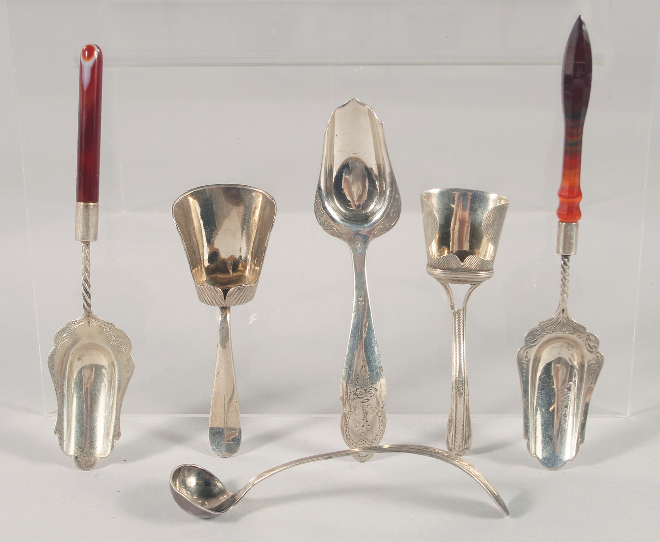 SIX SILVER CADDY AND MUSTARD SPOONS.