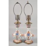 A PAIR OF CHINESE ARMORIAL STYLE PORCELAIN AND ORMOLU TABLE LAMPS. 19ins high including fitting