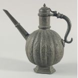 AN 18TH CENTURY MUGHAL INDIAN TINNED COPPER EWER, the ribbed body with embossed foliate