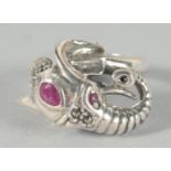 A SILVER RUBY SET ELEPHANT RING.