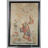 A CHINESE SILKWORK PICTURE of a man holding a peach. 25ins x 17ins.