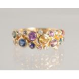 A GOOD MULTI- COLOURED SAPPHIRE HALF HOOP RING. 18CT GOLD.