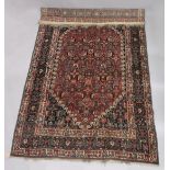 A GOOD PERSIAN CARPET, red ground with all over stylised floral decoration, attached label; Barin