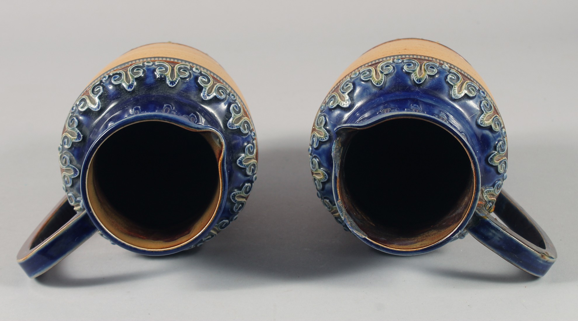 A PAIR OF ROYAL DOULTON STONEWARE JUGS with blue bands. 8ins high. - Image 5 of 6