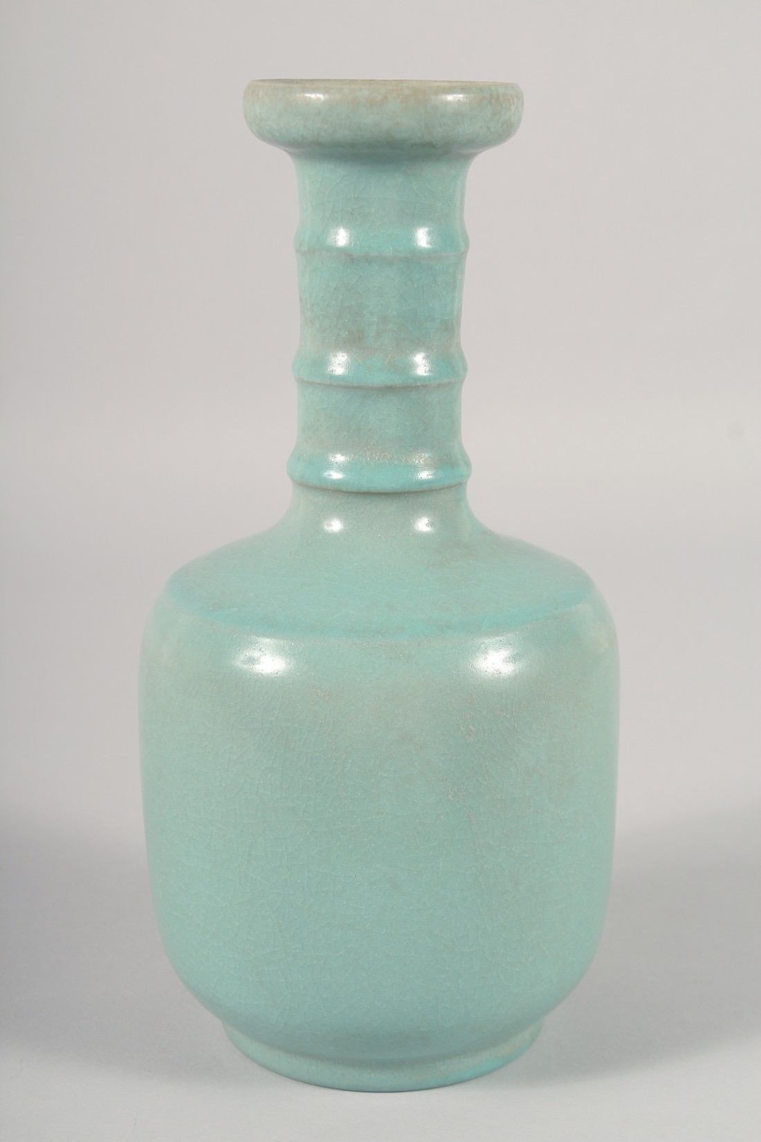 A CHINESE CELADON GLAZE VASE, with ribbed neck, 25.5cm high. - Image 3 of 5