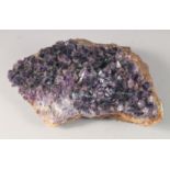 A LARGE AMETHYST CRYSTAL. 11ins long.