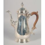 A GEORGE III SILVER COFFEE POT. Mark rubbed, maker E. W. Weighs 24oz.