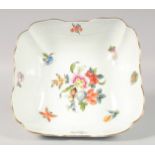 A HEREND SQUARE FRUIT BOWL painted with fruits and nuts. No. 180 BFR. 10ins wide.