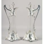 A PAIR OF ART NOUVEAU STYLE WMF GLASS CLARET JUGS WITH PLATED MOUNTS. 16.5" high