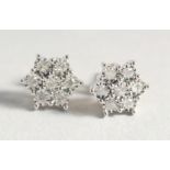 A VERY GOOD PAIR OF 9ct. GOLD DIAMOND CLUSTER EARRINGS.