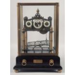 A GOOD REPRODUCTION ROLLING BALL CLOCK in a glass case with wooden stand. 15.5ins high.