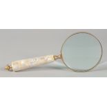 A MAGNIFYING GLASS with mother of pearl handle.