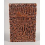 A CHINESE CANTON SANDALWOOD CARD CASE, carved with a busy village scene, 10.5cm x 7cm.