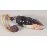 A JAPANESE CARVED WOOD AND MOTHER OF PEARL INRO, modelled as a bug. 11cm long.