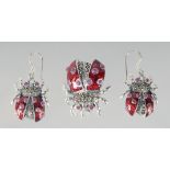 A PAIR OF SILVER RUBY AND ENAMEL BUG EARRINGS AND PENDANT.