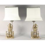 A PAIR OF CHINESE BRASS FIGURAL LAMPS, with shades, lamp / base 51.5cm high.