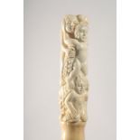 A WALKING STICK WITH CARVED BONE HANDLE as figures and grapes.