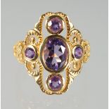 A SILVER AND GOLD-PLATED AMETHYST RING.